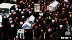Funeraliile copiilor uciși pe un teren de fotbal de o rachetă trasă din Liban, în Majdal Shams. 28 iulie 2024.