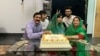 Malala Yousafzai (center) celebrates graduating from Oxford University at an undisclosed location on June 18.