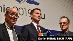 (Left to right:) French Foreign Minister Jean-Yves Drian, U.K. Foreign Secretary Jeremy Hunt, and German Foreign Minister Heiko Maas announced the launch of a financial mechanism to allow firms to trade with Iran on January 31. 
