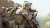 File photo of U.S. Marines return fire during a shootout in Helmand, May 2010.