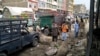 Members of the bomb disposal unit survey the site of a blast at a vegetable market in Quetta on April 12.