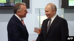 Stiv Uitkoff və Vladimir Putin