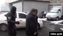 Armenia -- A screenshot of a National Security Service vide of the arrest of defense contractor Davit Galstian, February 1, 2021