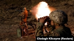 Soldiers from the Carpathian Sich volunteer battalion conduct maneuvers near the front line in Kreminna, Ukraine, on January 3.