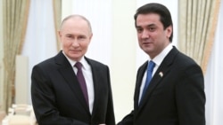 Russian President Vladimir Putin (left) and Rustam Emomali, the son of Tajik President Emomali Rahmon meet at the Kremlin. (file photo)