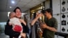 Iran -- Wounded people react following an Israel airstrike in central Tehran, Iran, 15 June 2025