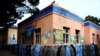Afghan women queue outside a school to vote in presidential elections in the western city of Herat.